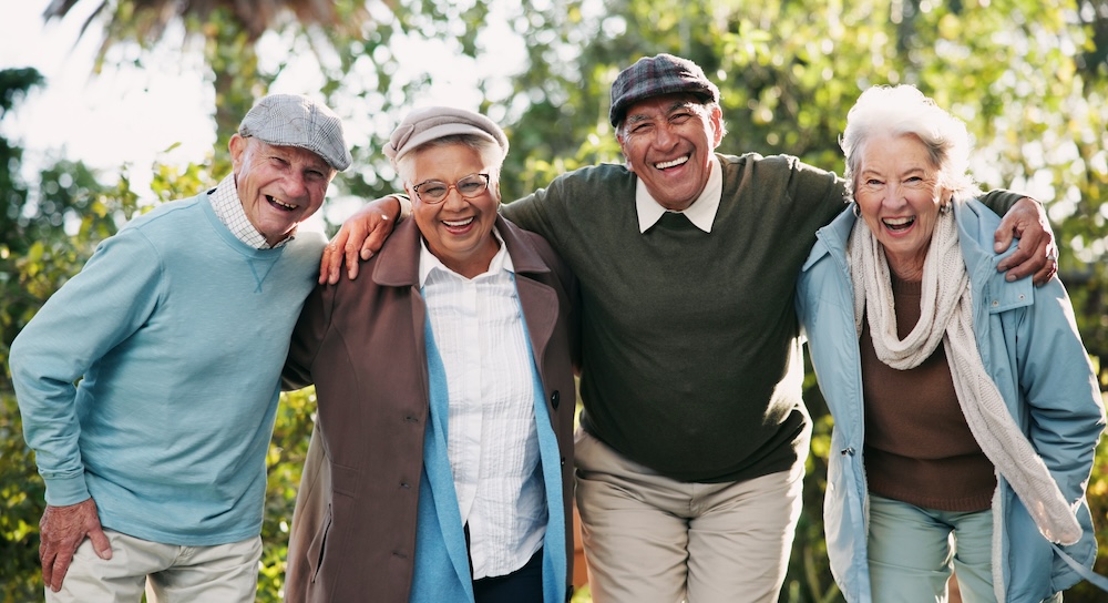 Group of seniors outside enjoying the benefits of continuing care retirement community